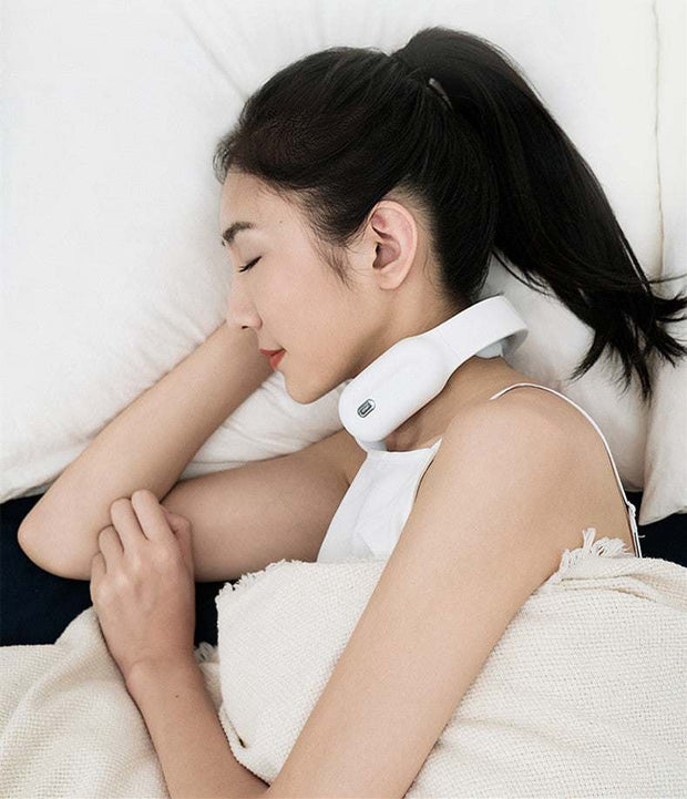 Woman lying down using a multifunctional remote control neck massager.