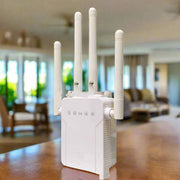 White WiFi Extender with four antennas in a modern living room setting.