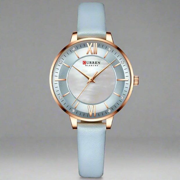 Ladies fashion watch with light blue leather strap and quartz movement.