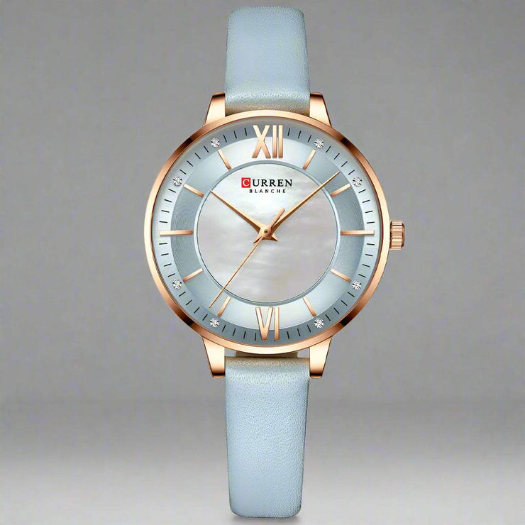 Ladies fashion watch with light blue leather strap and quartz movement.