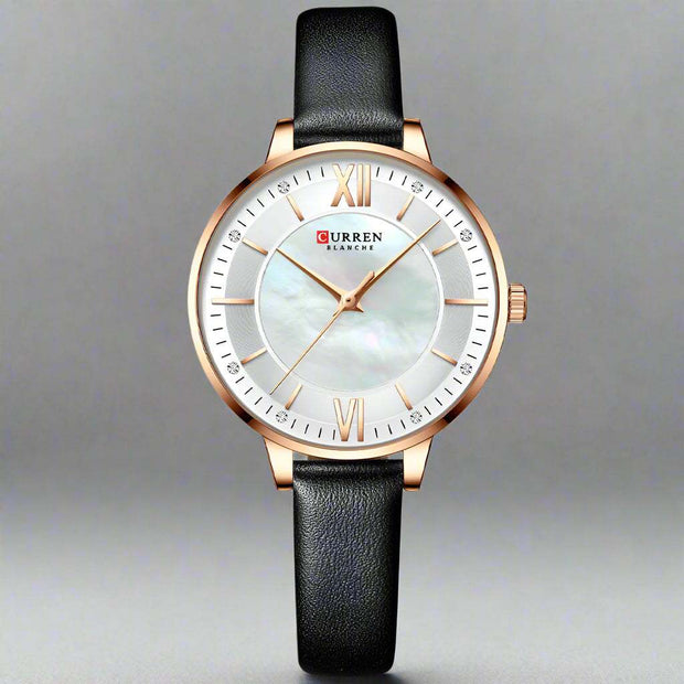 Ladies fashion watch with black genuine leather strap, round dial, and quartz movement.