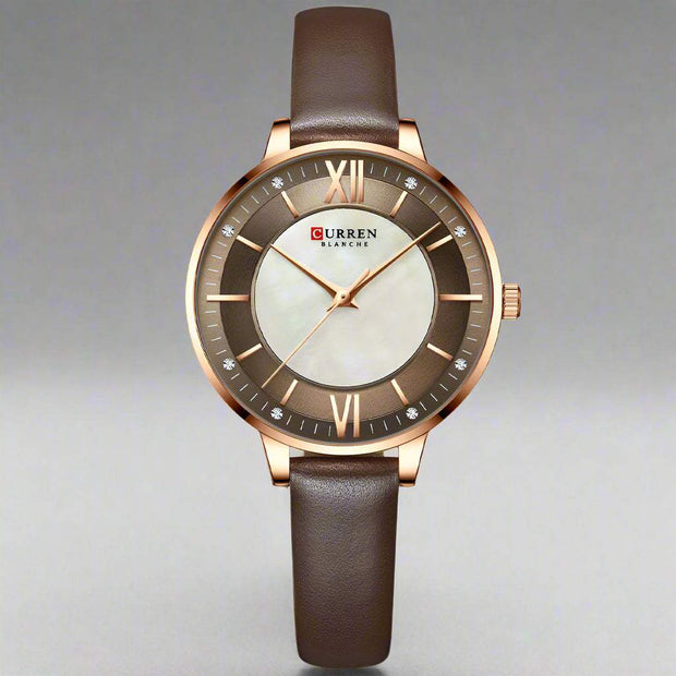 Ladies fashion quartz watch with brown leather strap and round alloy case.