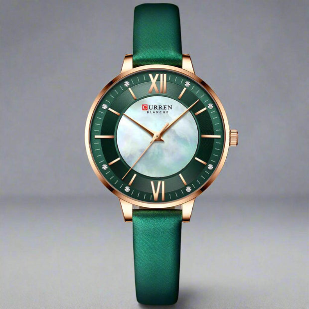 Ladies fashion watch with green genuine leather strap and round alloy case, featuring a quartz movement and waterproof design.