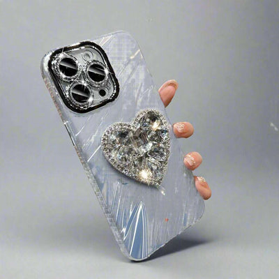 Silver rhinestone phone case with lens protector and heart bracket, compatible with iPhone.