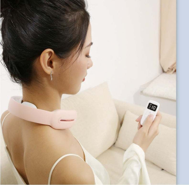 Woman using a pink multifunctional neck massager with remote control.