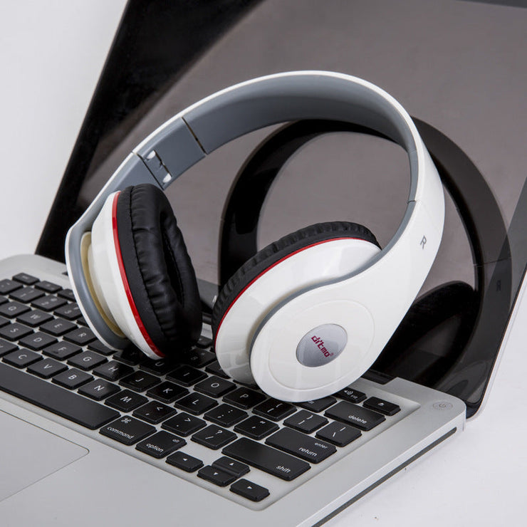 Wired gaming headphone with heavy bass, stylish design, on a laptop.