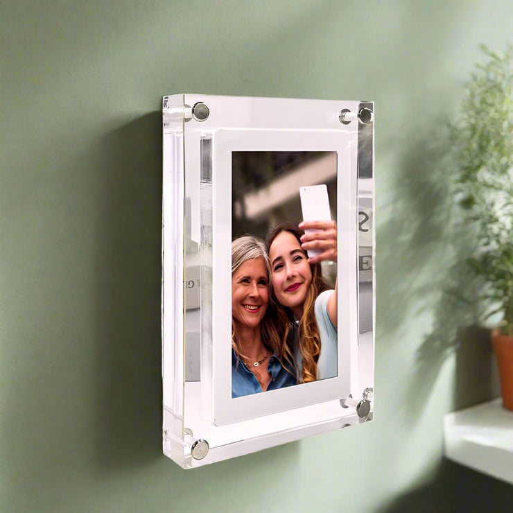 7-inch digital picture frame with plastic casing displaying a photo, offers buy 2 get 1 free deal.