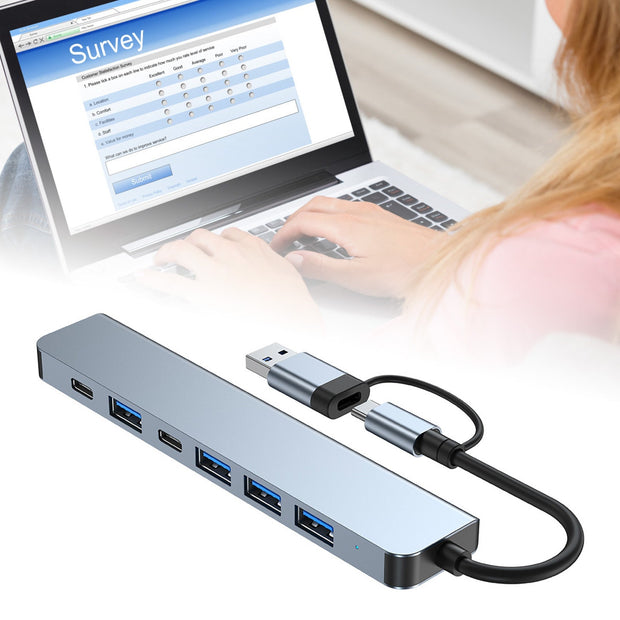 7 in 1 Type C Hub aluminum USB docking station with 7 ports for keyboards and PCs.