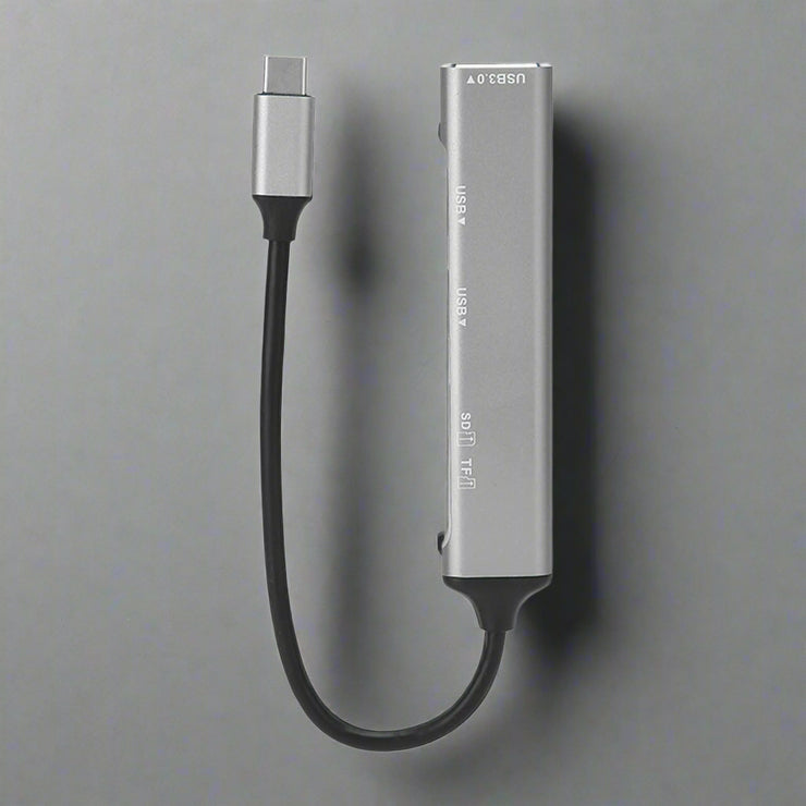 5 in 1 USB C Hub Adapter with multiple ports and high-speed connectivity.