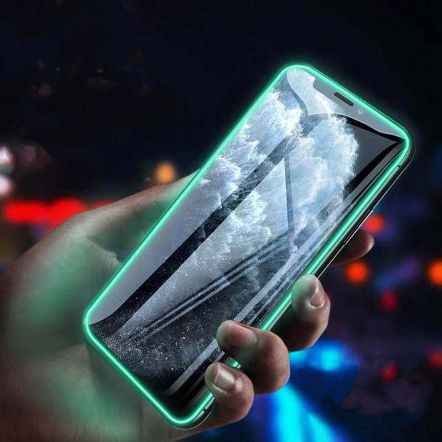 Luminous Full Cover Tempered Glass on Smartphone, glowing in the dark.