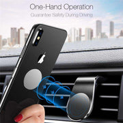 360° magnetic car phone holder mounted on air vent, featuring one-hand operation for safe driving.