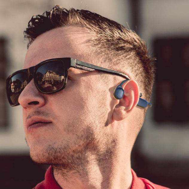 Personal Bone Conduction Bluetooth Headset worn by a user outdoors.