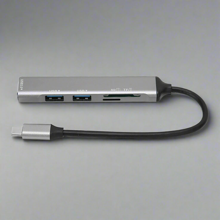 5 in 1 USB C Hub with 3 USB ports, SD/TF card reader, and Type C adapter.