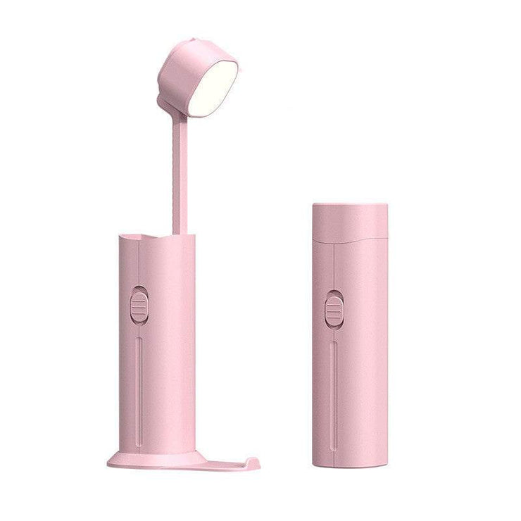 Portable pink desk lamp and flashlight with rechargeable power bank feature.