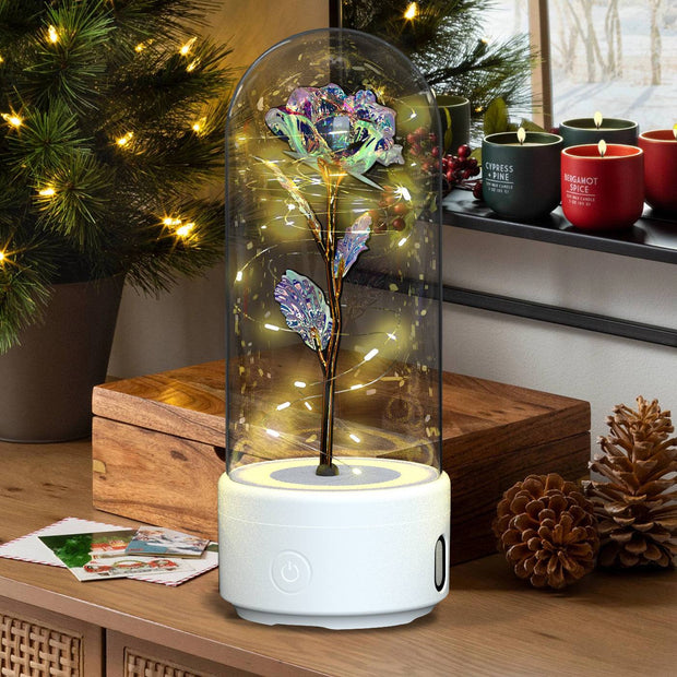 Rose LED light and Bluetooth speaker in glass cover, perfect for romantic decorations.