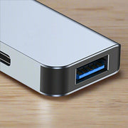 7 in 1 Type C Hub aluminum alloy USB docking station with charging port.