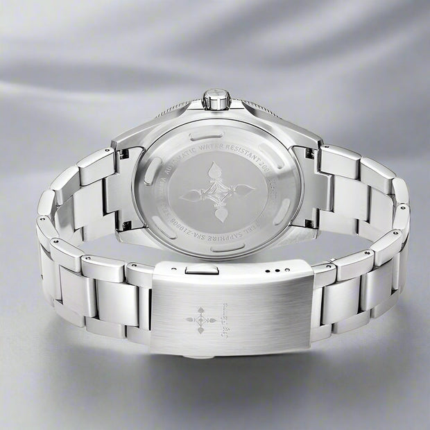 Back view of a stainless steel GMT luminous waterproof men's watch with sapphire glass and double press button clasp