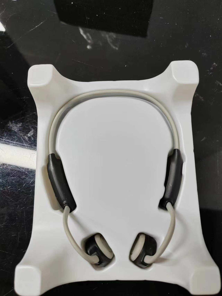 Personal Bone Conduction Bluetooth Headset in packaging, featuring titanium alloy ear hooks.