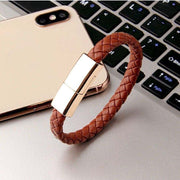 Braided leather bracelet USB charging cable for iPhone and USB-C devices.